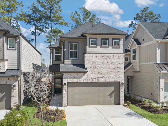 view of front of property with a garage, driveway, a shingled roof, and brick siding