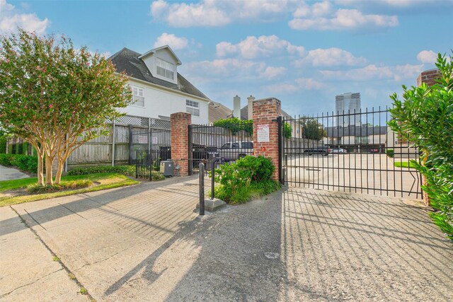 view of gate with fence