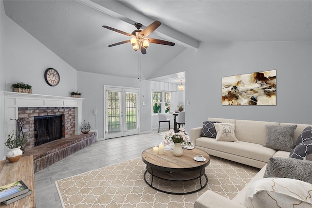 living room with french doors, a fireplace, vaulted ceiling with beams, a ceiling fan, and baseboards