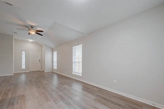 interior space with visible vents, light wood-style flooring, and baseboards