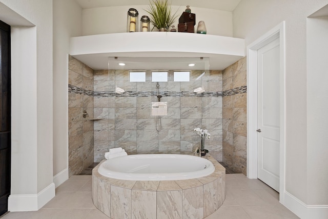 full bathroom with a walk in shower, baseboards, a bath, and tile patterned floors