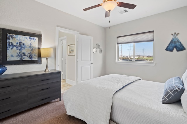 bedroom featuring carpet flooring, visible vents, and a ceiling fan