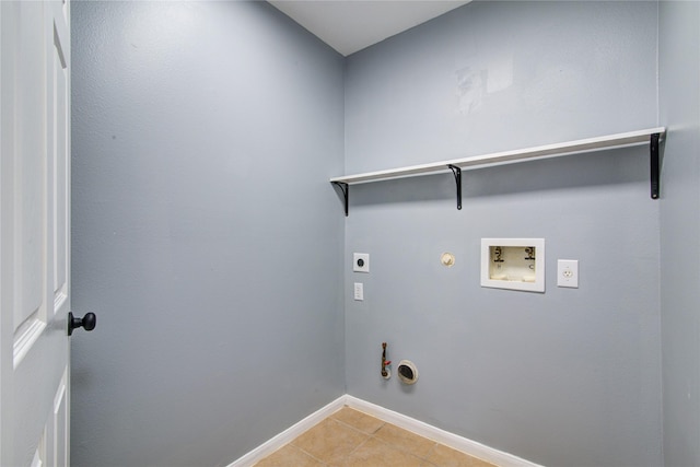 washroom featuring laundry area, hookup for a gas dryer, hookup for an electric dryer, washer hookup, and light tile patterned flooring