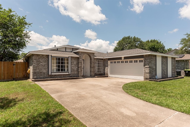 28907 Sedgefield St, Spring, TX 77386 - view of front of property with brick siding, an attached garage, and concrete driveway
