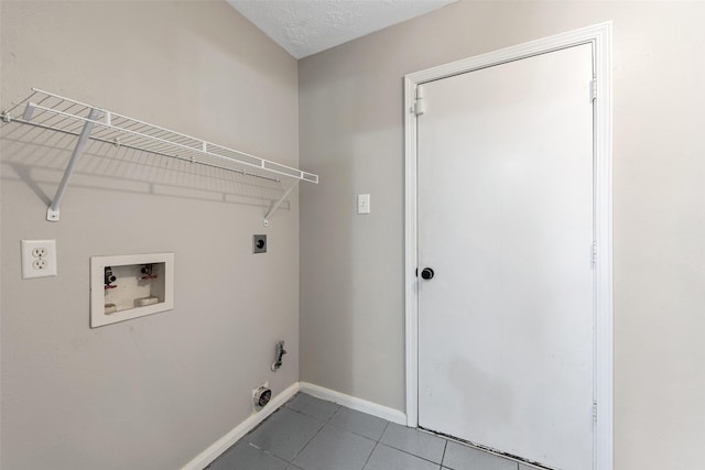 28907 Sedgefield St, Spring, TX 77386 - laundry room with electric dryer hookup, hookup for a washing machine, tile patterned flooring, and baseboards
