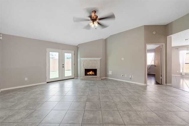 28907 Sedgefield St, Spring, TX 77386 - unfurnished living room featuring ceiling fan, tile patterned floors, french doors, lofted ceiling, and baseboards