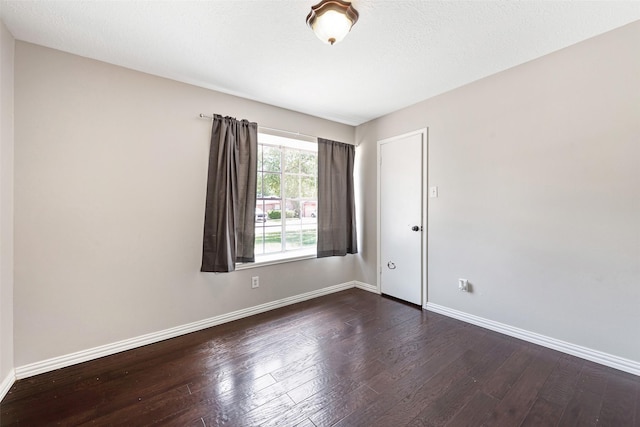 28907 Sedgefield St, Spring, TX 77386 - empty room featuring dark wood-type flooring and baseboards