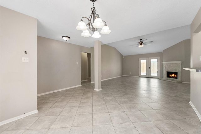 28907 Sedgefield St, Spring, TX 77386 - unfurnished living room with ceiling fan, light tile patterned floors, vaulted ceiling, baseboards, and a chandelier