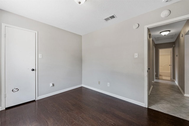28907 Sedgefield St, Spring, TX 77386 - spare room featuring wood-type flooring, baseboards, a smoke detector, and attic access