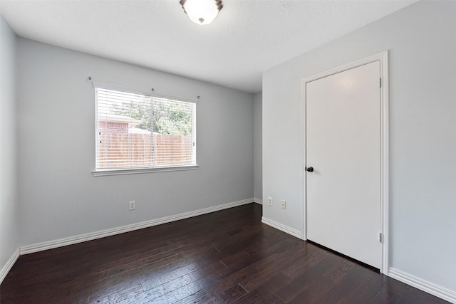 28907 Sedgefield St, Spring, TX 77386 - unfurnished bedroom with dark wood-style flooring and baseboards