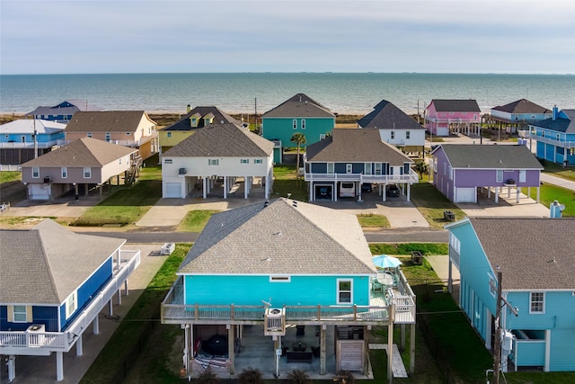 bird's eye view featuring a water view and a residential view