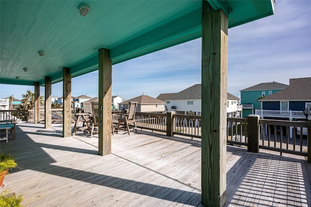 wooden terrace with a residential view