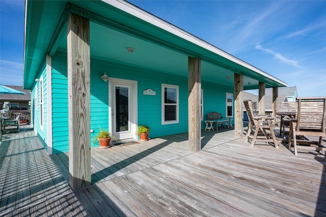 deck with outdoor dining area