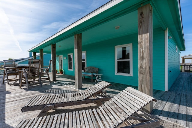 wooden deck featuring outdoor dining area