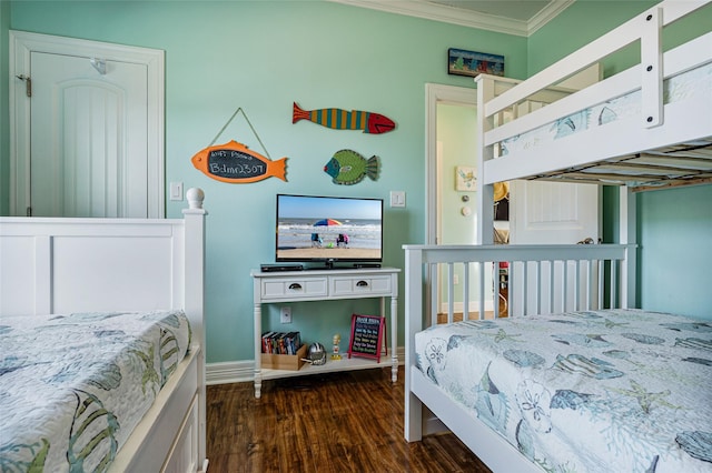 bedroom featuring baseboards, ornamental molding, and dark wood-style flooring