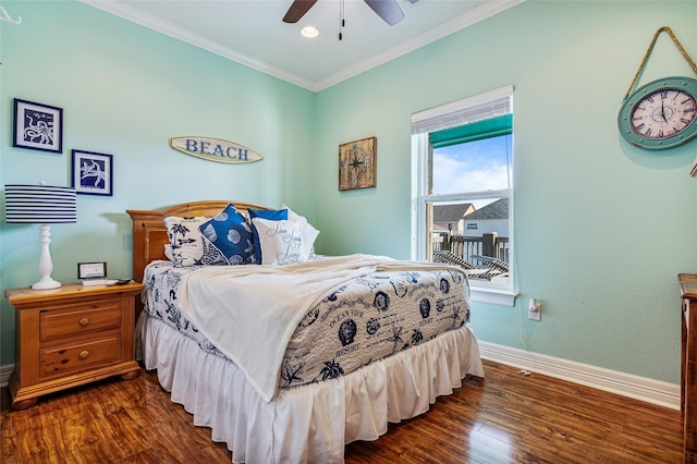 bedroom with dark wood-style floors, baseboards, a ceiling fan, and crown molding