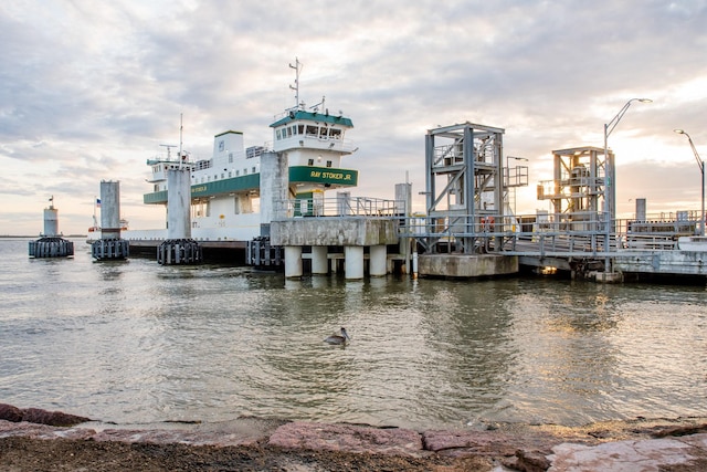 dock area featuring a water view and a view of city