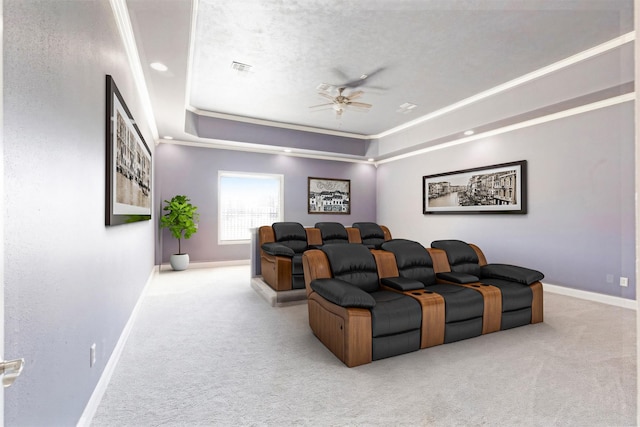 carpeted cinema with a tray ceiling, recessed lighting, a ceiling fan, a textured ceiling, and baseboards