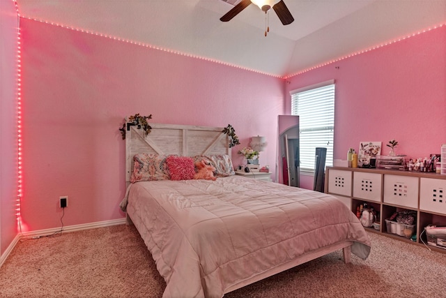 carpeted bedroom featuring vaulted ceiling, ceiling fan, and baseboards