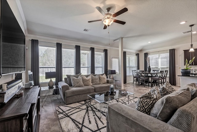 living room featuring a textured ceiling, visible vents, and a ceiling fan