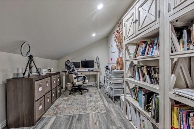 home office featuring lofted ceiling, recessed lighting, and wood finished floors