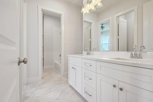 26726 Estuary Dr, Galveston, TX 77554 - full bath featuring marble finish floor, double vanity, shower / washtub combination, and a sink