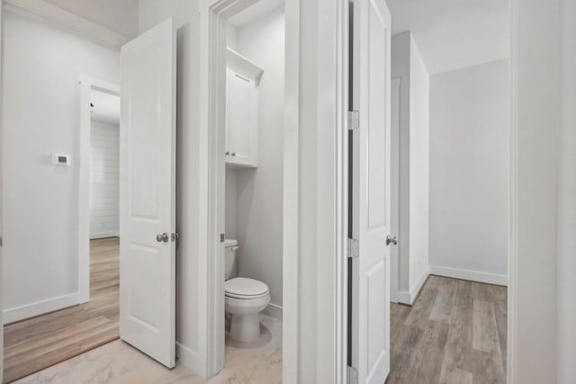 26726 Estuary Dr, Galveston, TX 77554 - bathroom with baseboards, toilet, and wood finished floors