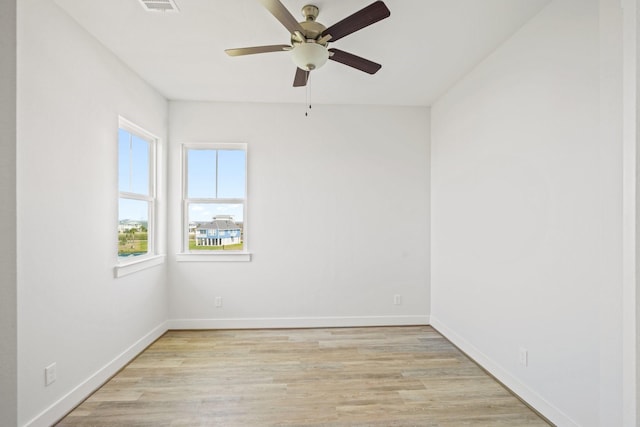 26726 Estuary Dr, Galveston, TX 77554 - empty room with a ceiling fan, visible vents, light wood-style flooring, and baseboards