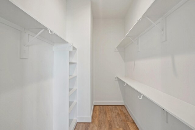 26726 Estuary Dr, Galveston, TX 77554 - spacious closet with light wood-type flooring