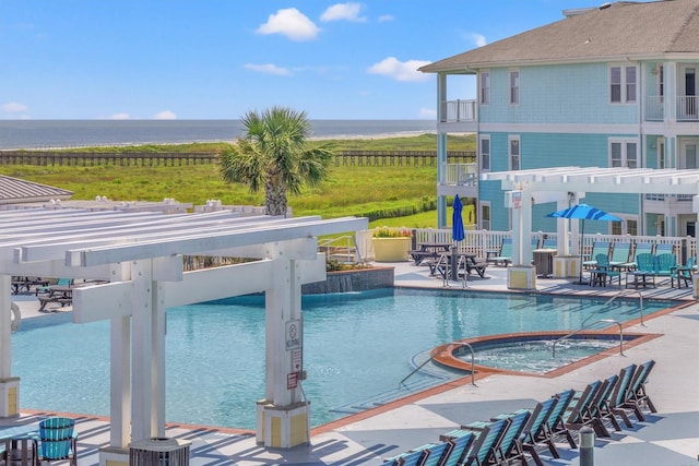 26726 Estuary Dr, Galveston, TX 77554 - pool featuring a community hot tub, a water view, a patio, and a pergola