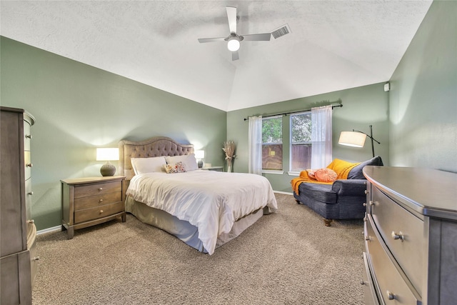 bedroom with baseboards, lofted ceiling, ceiling fan, a textured ceiling, and carpet floors