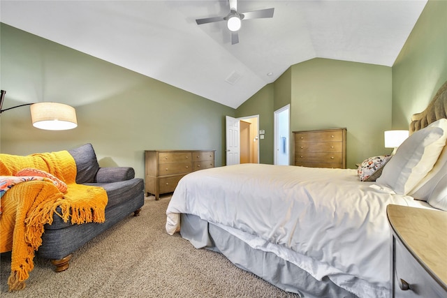 carpeted bedroom featuring lofted ceiling, visible vents, and a ceiling fan