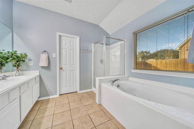 bathroom featuring tile patterned flooring, a shower stall, vanity, and a textured ceiling