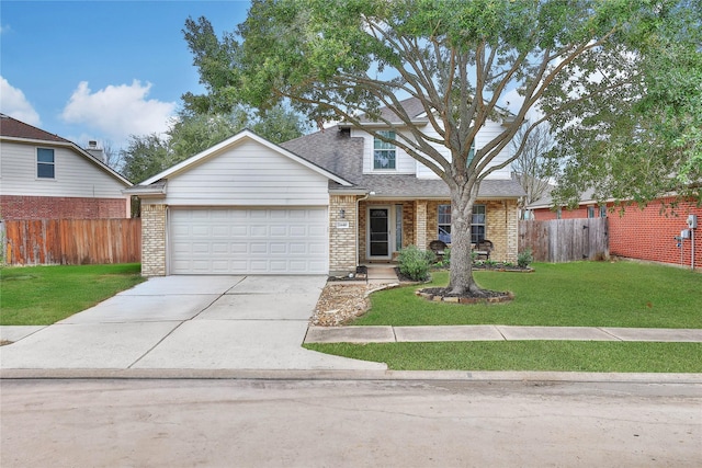 view of front of home featuring brick siding, a front lawn, and fence