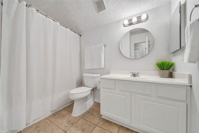 full bath featuring visible vents, toilet, tile patterned flooring, a textured ceiling, and vanity