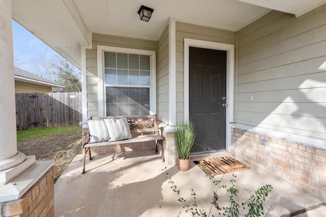 doorway to property with fence