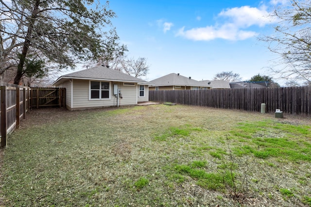 view of yard featuring a fenced backyard