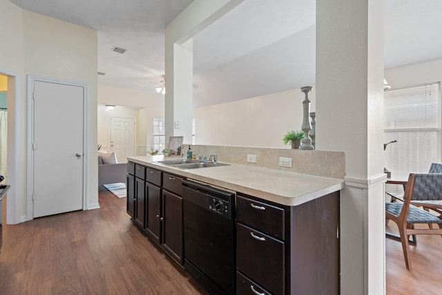 kitchen with a sink, dark brown cabinetry, light countertops, and dishwasher