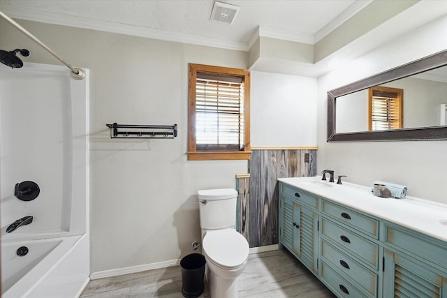 full bathroom with visible vents, toilet, wood finished floors, crown molding, and vanity