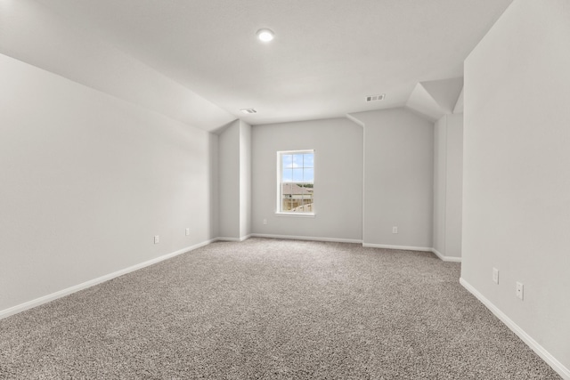 16535 Willow Forest Dr, Conroe, TX 77302 - bonus room featuring carpet, lofted ceiling, and baseboards