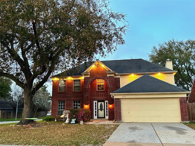 view of front of house with a garage, brick siding, driveway, and roof with shingles