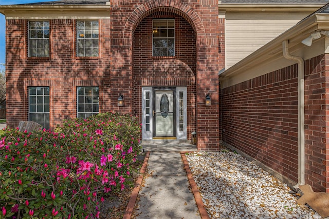 property entrance with brick siding