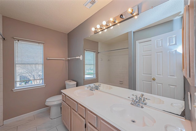 full bath featuring a sink, visible vents, toilet, and a healthy amount of sunlight