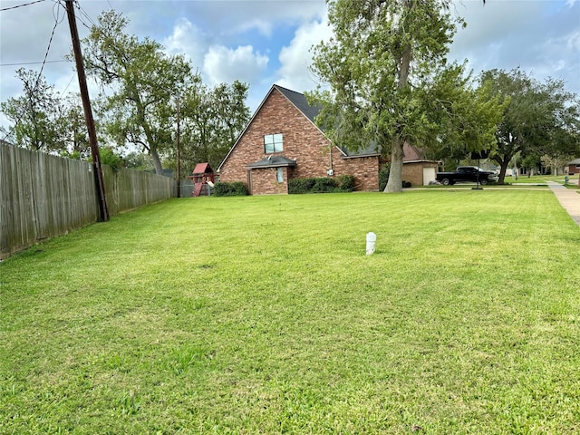 view of yard with fence