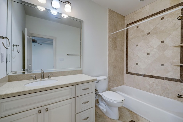 bathroom featuring toilet, tub / shower combination, vanity, and tile patterned floors