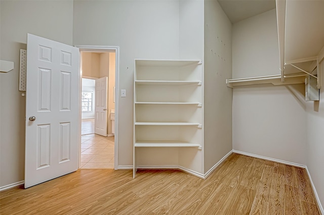 walk in closet featuring light wood-style floors