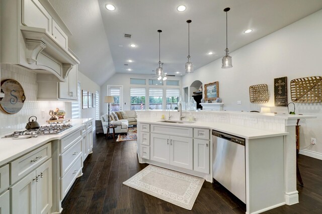 21825 S Enchanted Rock Dr, Porter, TX 77365 - kitchen with a sink, stainless steel appliances, open floor plan, backsplash, and light countertops