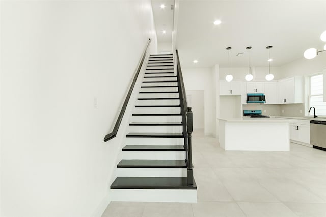 staircase with recessed lighting