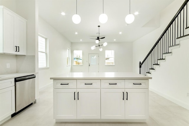 kitchen featuring dishwasher, light countertops, recessed lighting, light tile patterned flooring, and white cabinets