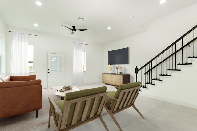 living area with visible vents, recessed lighting, stairway, baseboards, and ceiling fan